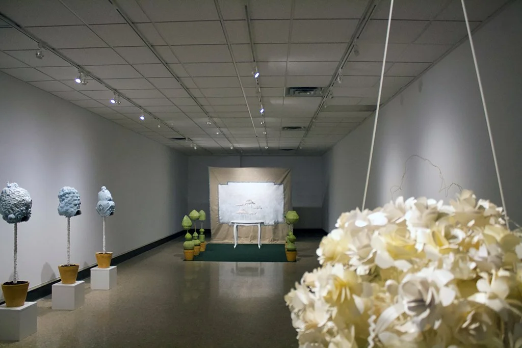  Without Worry , Installation at a variable size, White Earthenware, Wood, Paint, Spray Paint, Beads, Canvas, Lace, Paper, Found Table, Rug and other miscellaneous materials, 2021		