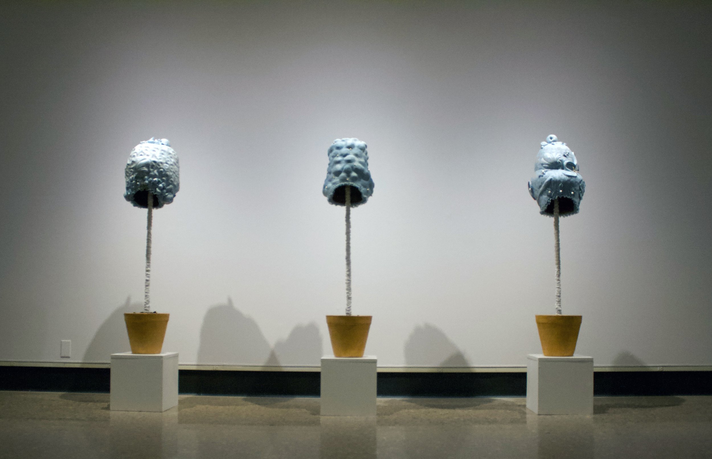 Without Worry, installation, variable size white earthenware, wood, paint, spray paint, beads, canvas, lace, paper, found table, rug and other miscellaneous materials, 2021