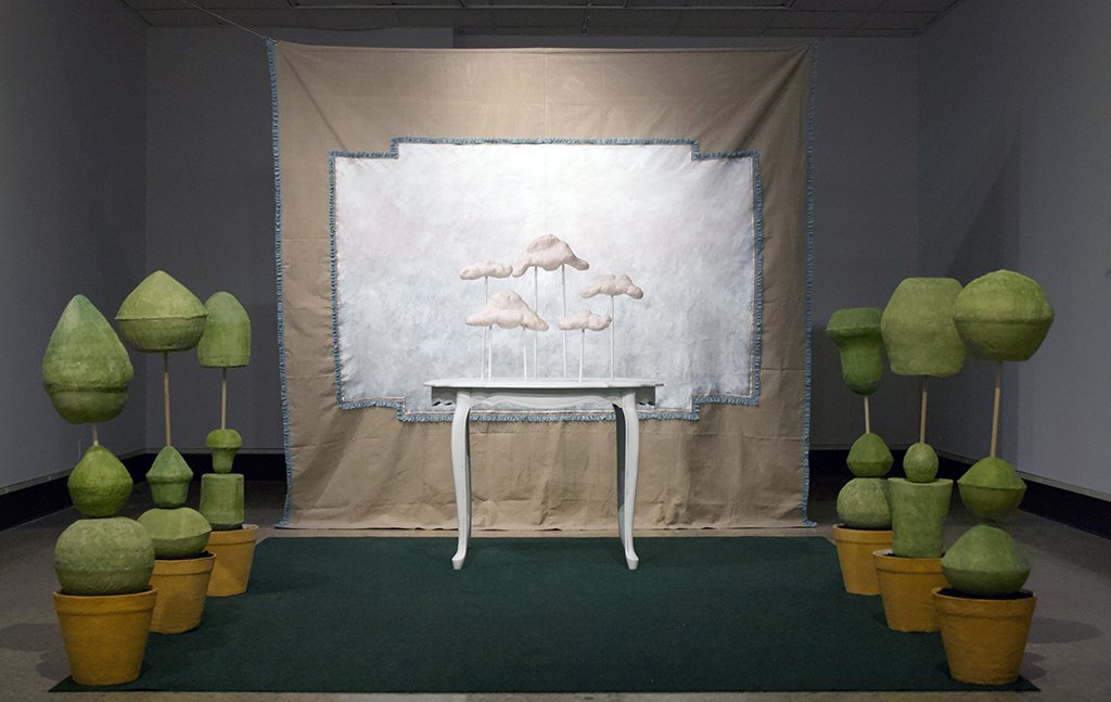  Without Worry , Installation at a variable size, White Earthenware, Wood, Paint, Spray Paint, Beads, Canvas, Lace, Paper, Found Table, Rug and other miscellaneous materials, 2021																				