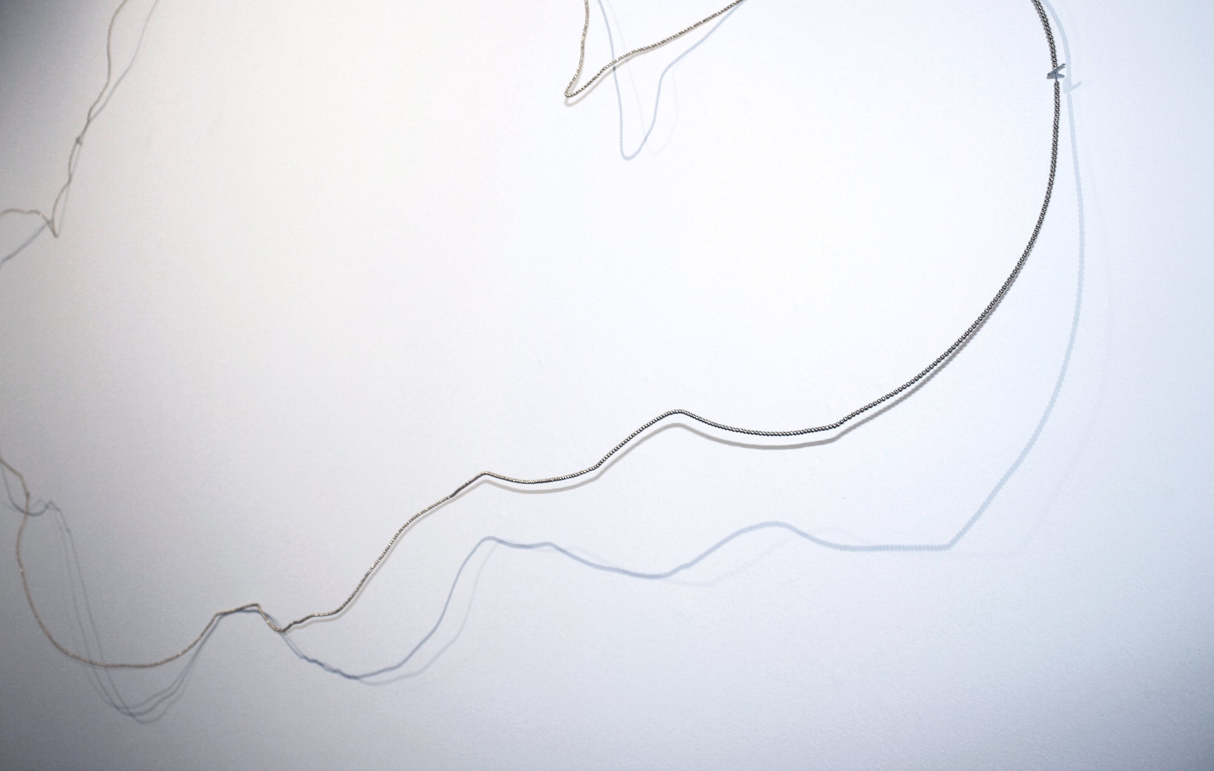 Without Worry, installation, variable size white earthenware, wood, paint, spray paint, beads, canvas, lace, paper, found table, rug and other miscellaneous materials, 2021