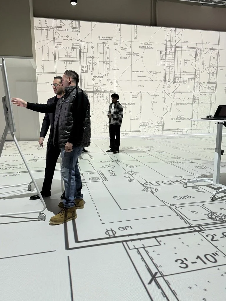 Builders and developers walking full scale plans