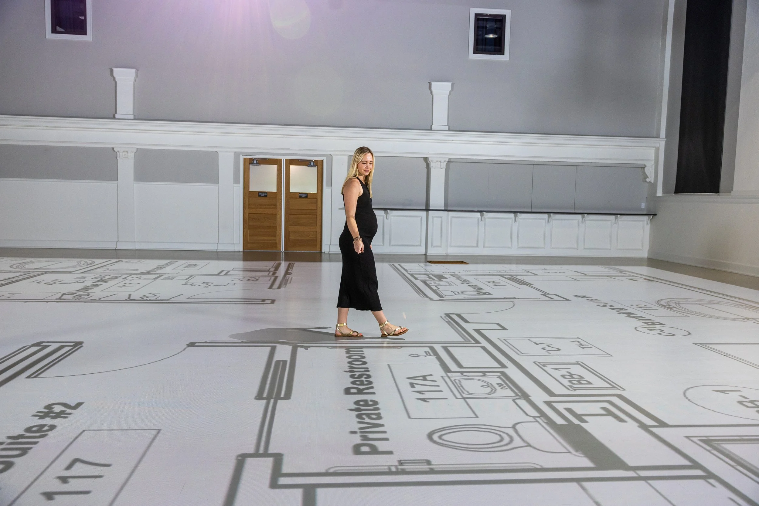 Woman walking new retail store buildout