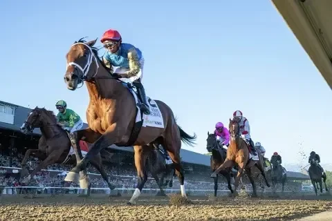 Leading Change and jockey Manny Franco race at Saratoga during the Travers Stakes.