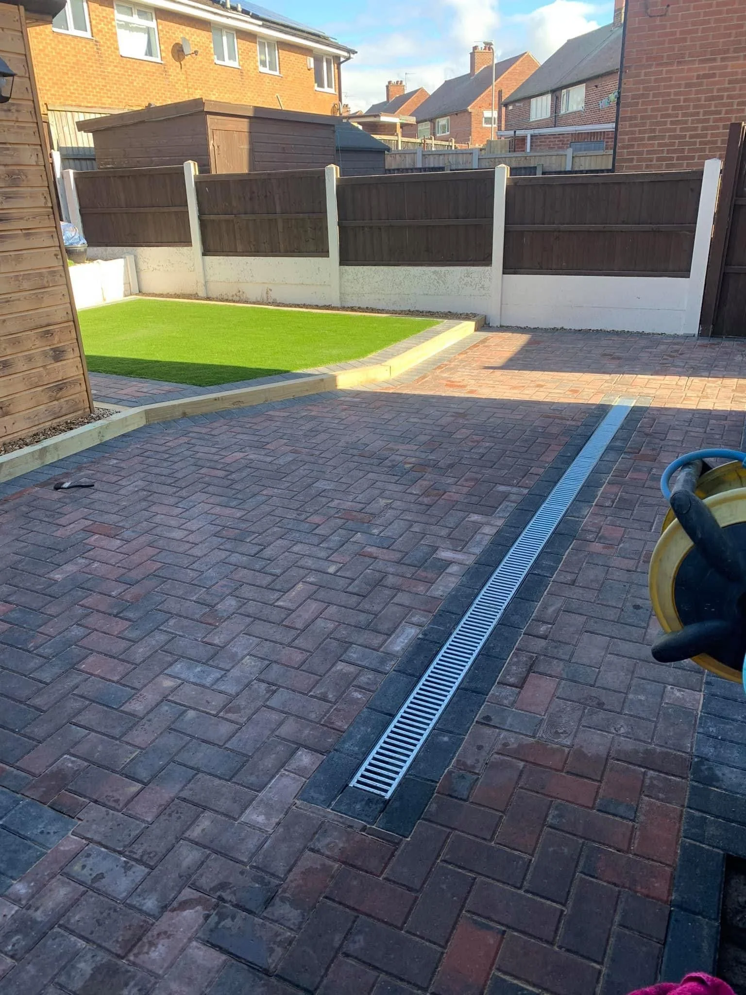 Our client wanted an attractive and functional outdoor space to complement their summerhouse and pub shed.
We installed high-quality artificial grass for a low-maintenance, year-round lawn. Added sleeper borders for defined, stylish planting areas. A