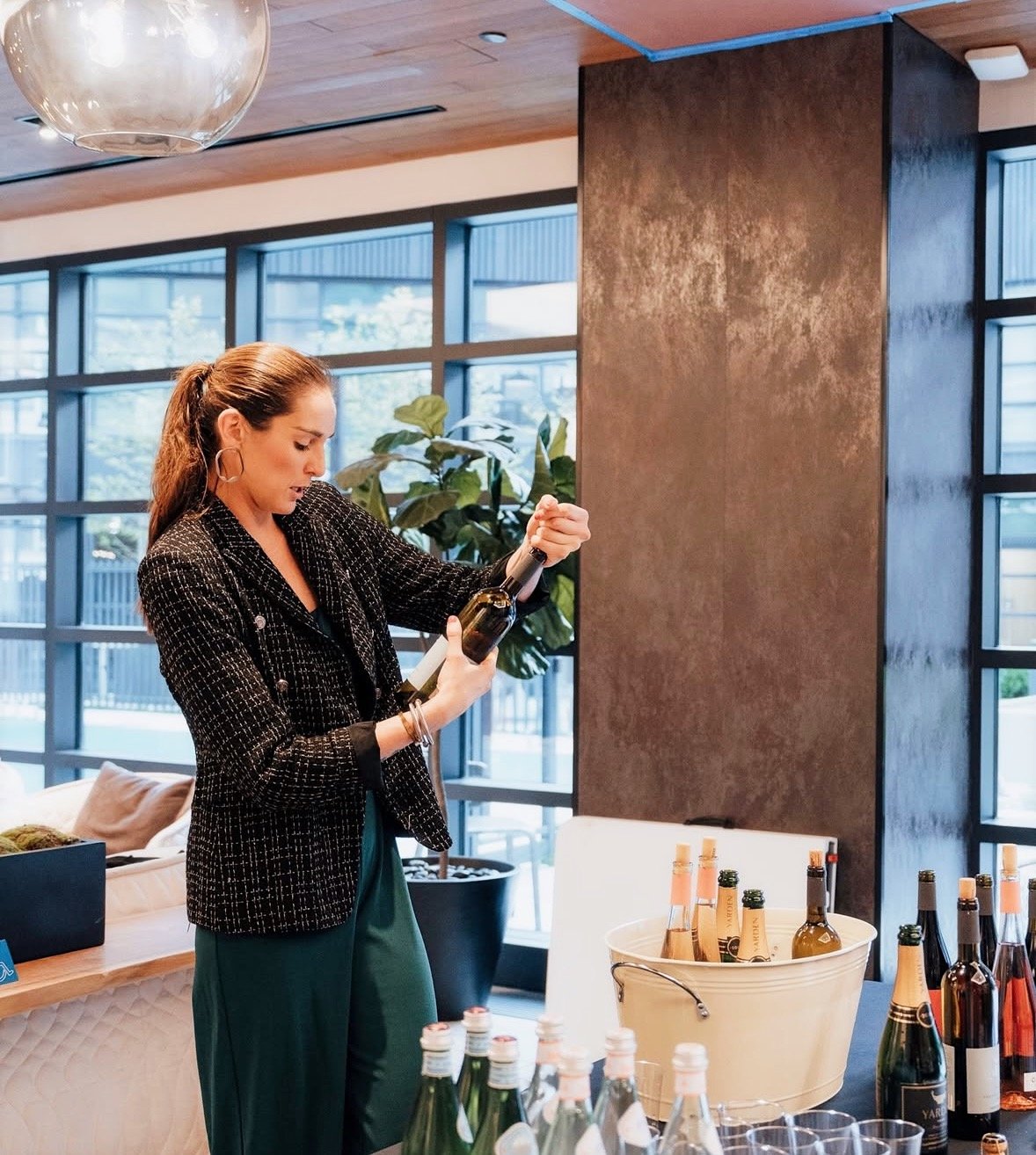 Sommelier opening wine at a private Night Inn wine tasting in NYC