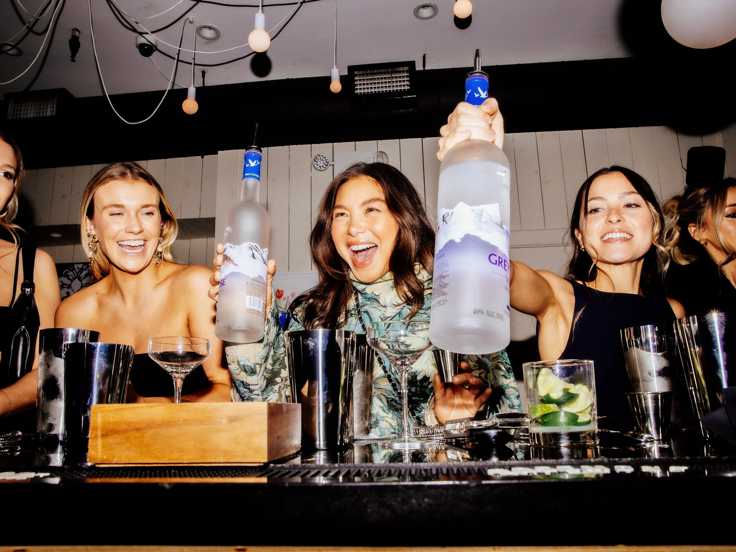 Guests celebrating with cocktails at a Night Inn corporate event in NYC