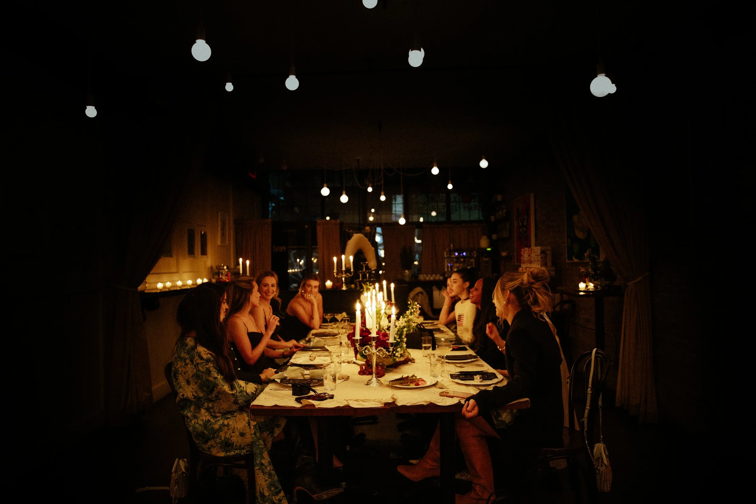 Candlelit private dinner party hosted by Night Inn in New York City