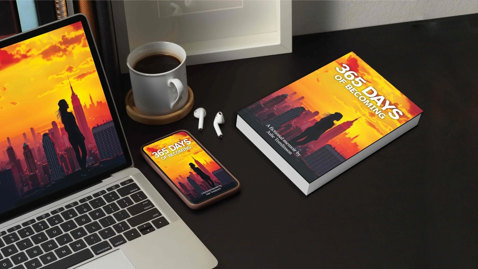 Photo showcasing 365 Days of Becoming by Julie Tomlinson displayed on a laptop, an iPhone, and as a physical book on a desk. Used on her copywriting portfolio site to highlight her work as a published author and storyteller.