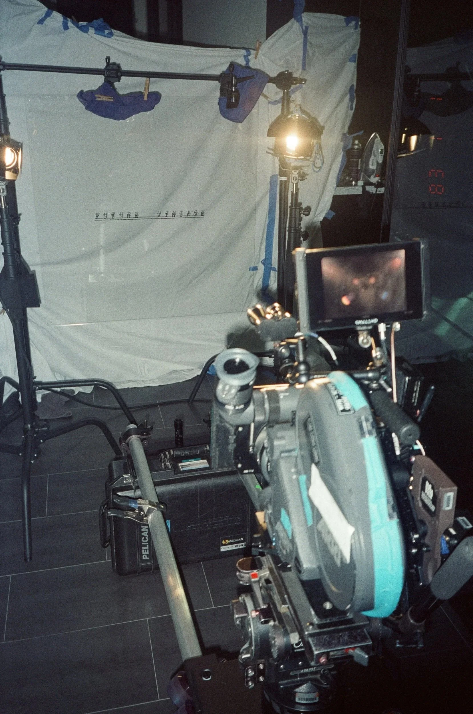 The camera rig and monitor in front of the lit Future Vintage cloth.