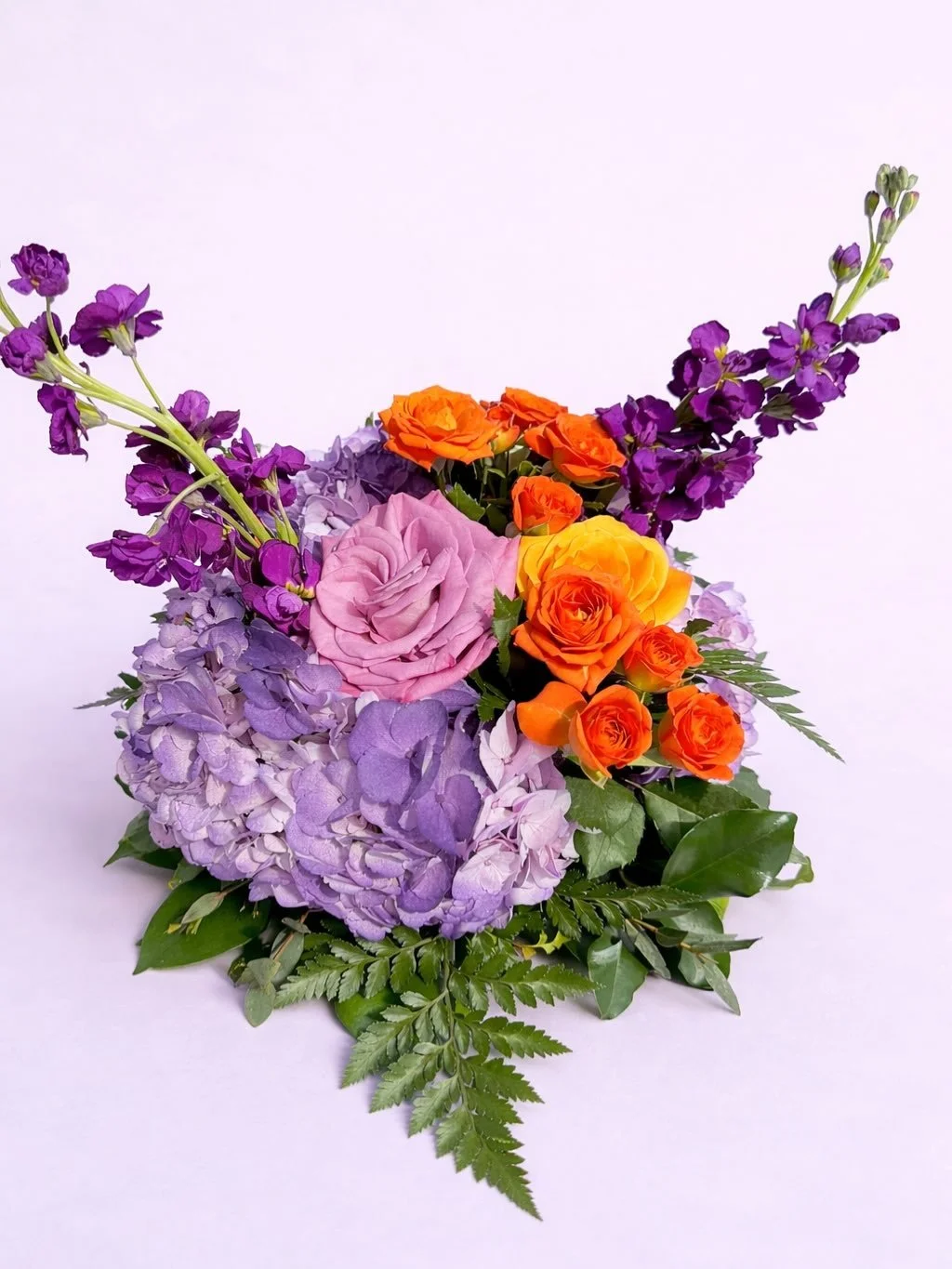 PHOENIX SUNS themed floral centerpieces 💜🧡 

Planning an event in Arizona and want florals that actually stand out? 💐

This custom arrangement blends bold orange roses with soft lavender tones for that perfect balance of vibrant and elegant. Wheth
