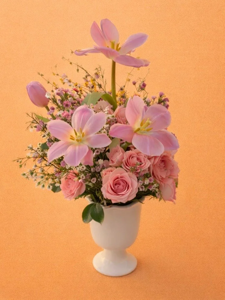 Introducing a new design in our Spring Collection 🌸
Soft pink garden roses, tulips, and delicate seasonal blooms arranged in our signature pedestal vase, inspired by warm Arizona days and fresh spring mornings.

Now available as part of our Spring C