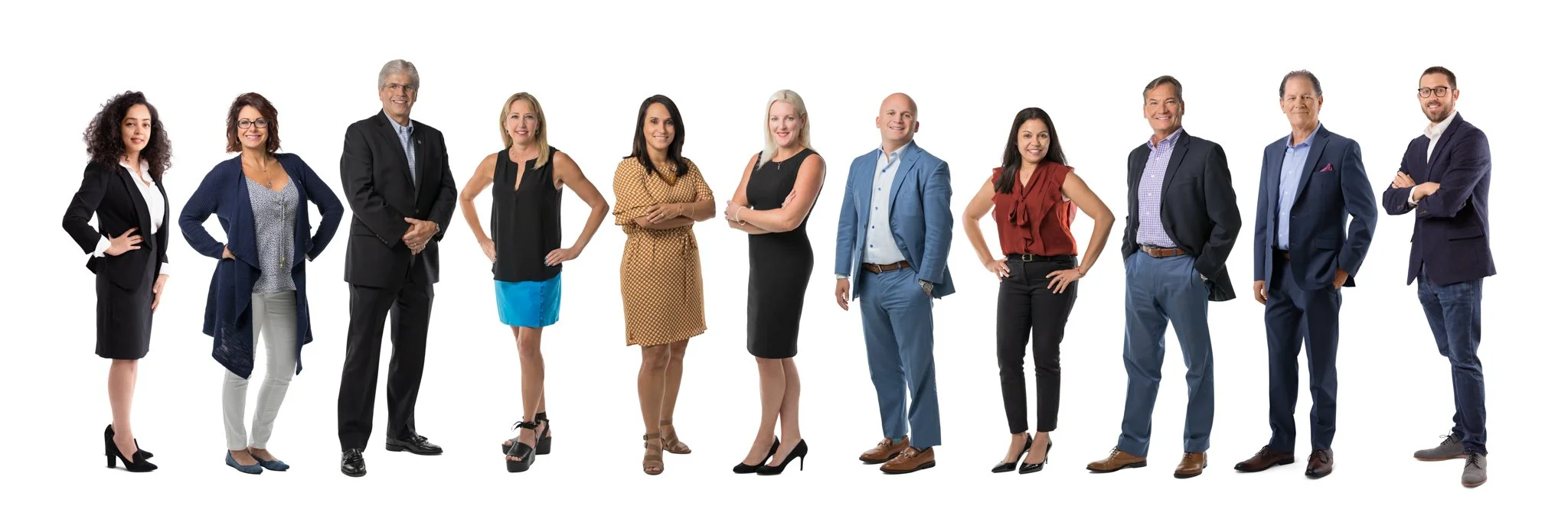 Group of diverse business professionals standing in a line against a white background.