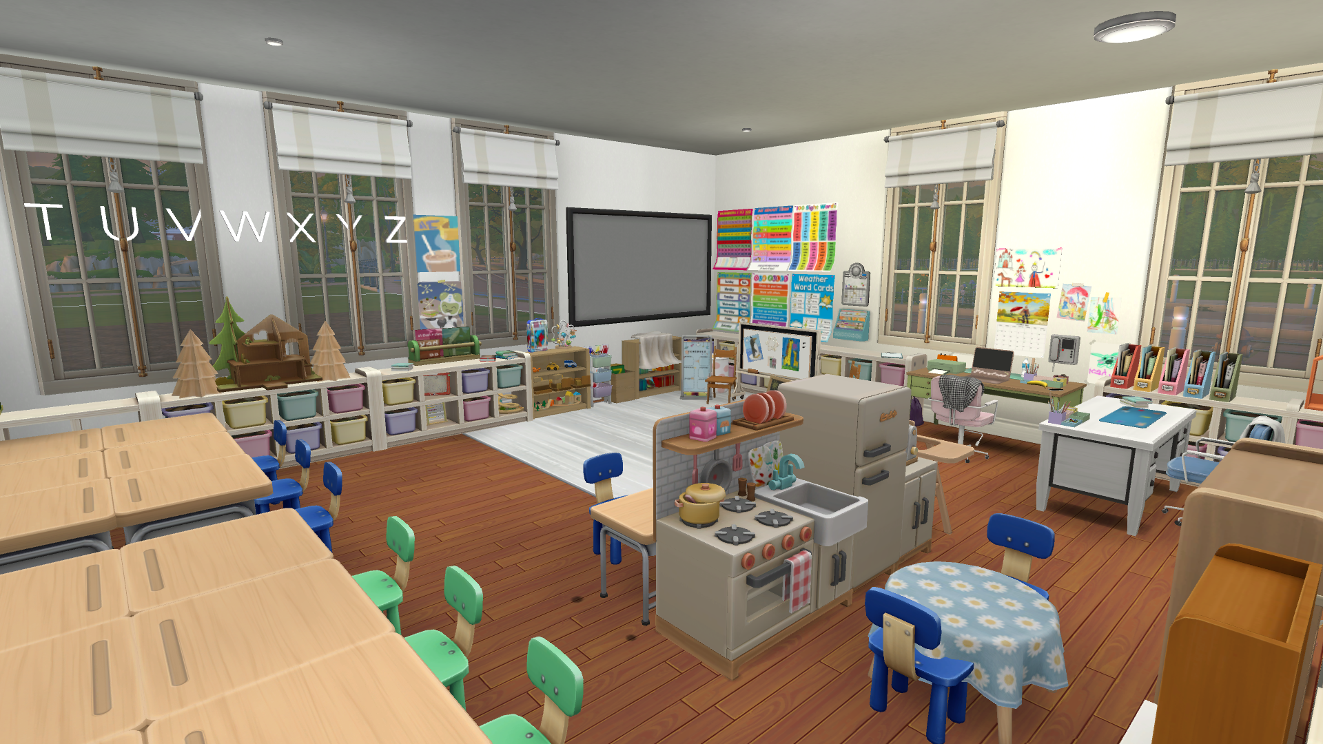In this photo you can see the desks set up into tables, the kitchen play area, the teacher desks and the carpet + smartboard.