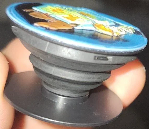 collapsible phone grip with a colorful raised design uv printed on the top.