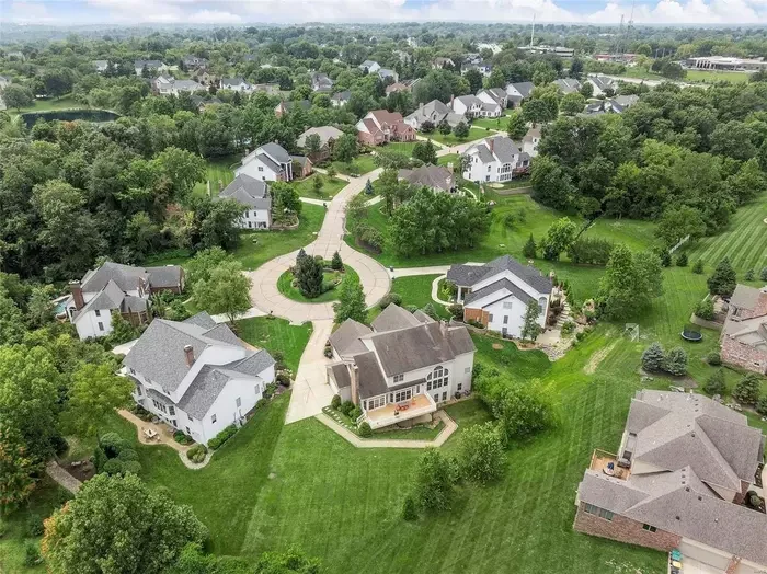 An overhead image of suburban homes surrounded by greenery in Devonworth Manor Way, Chesterfield, MO
