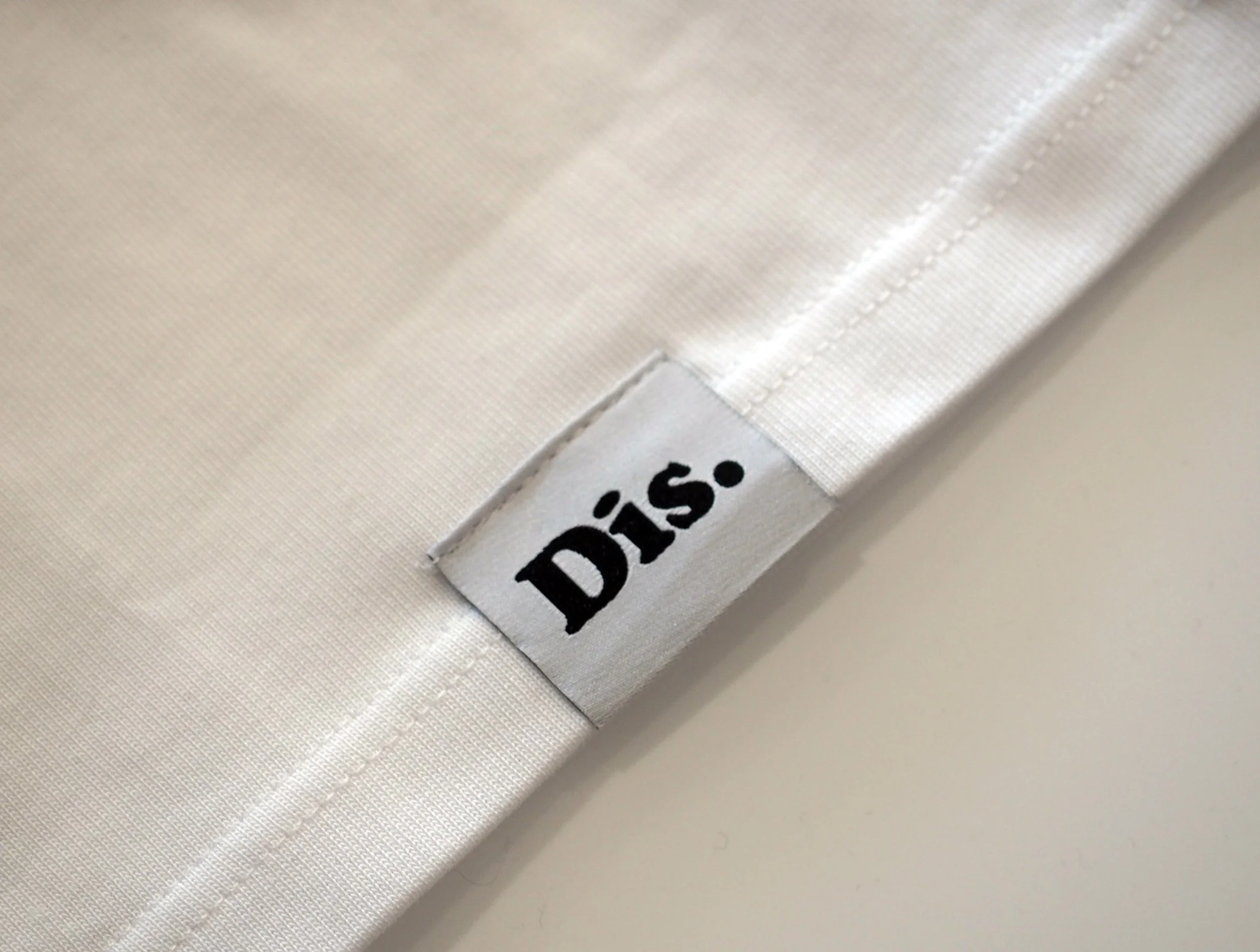 Dis label white close up.jpg