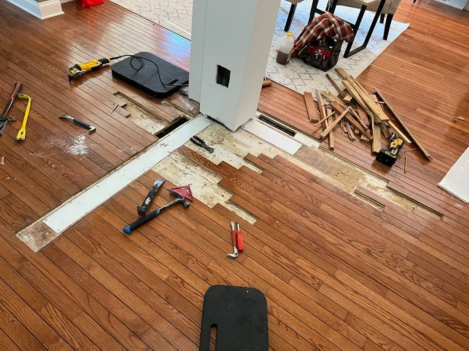 Repairing hard wood floors and removing a half wall. 