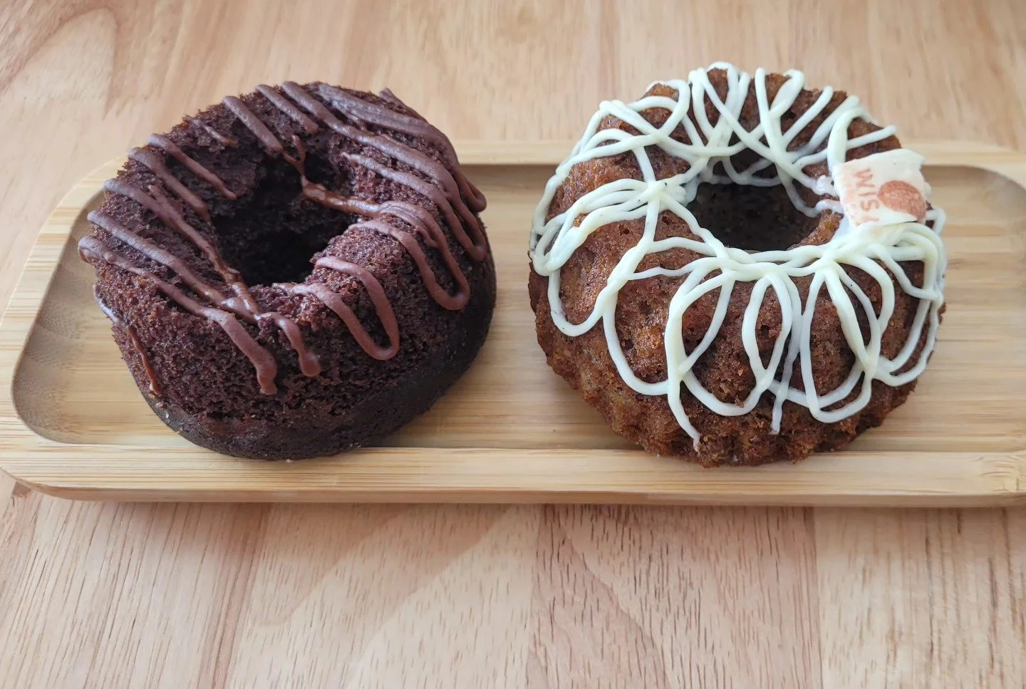 Indulge in our rich Chocolate &amp; Banana Bundt Cakes gluten-free, dairy-free, and infused with real vanilla bean straight from the heart of Uganda. Pure flavor, no compromise.