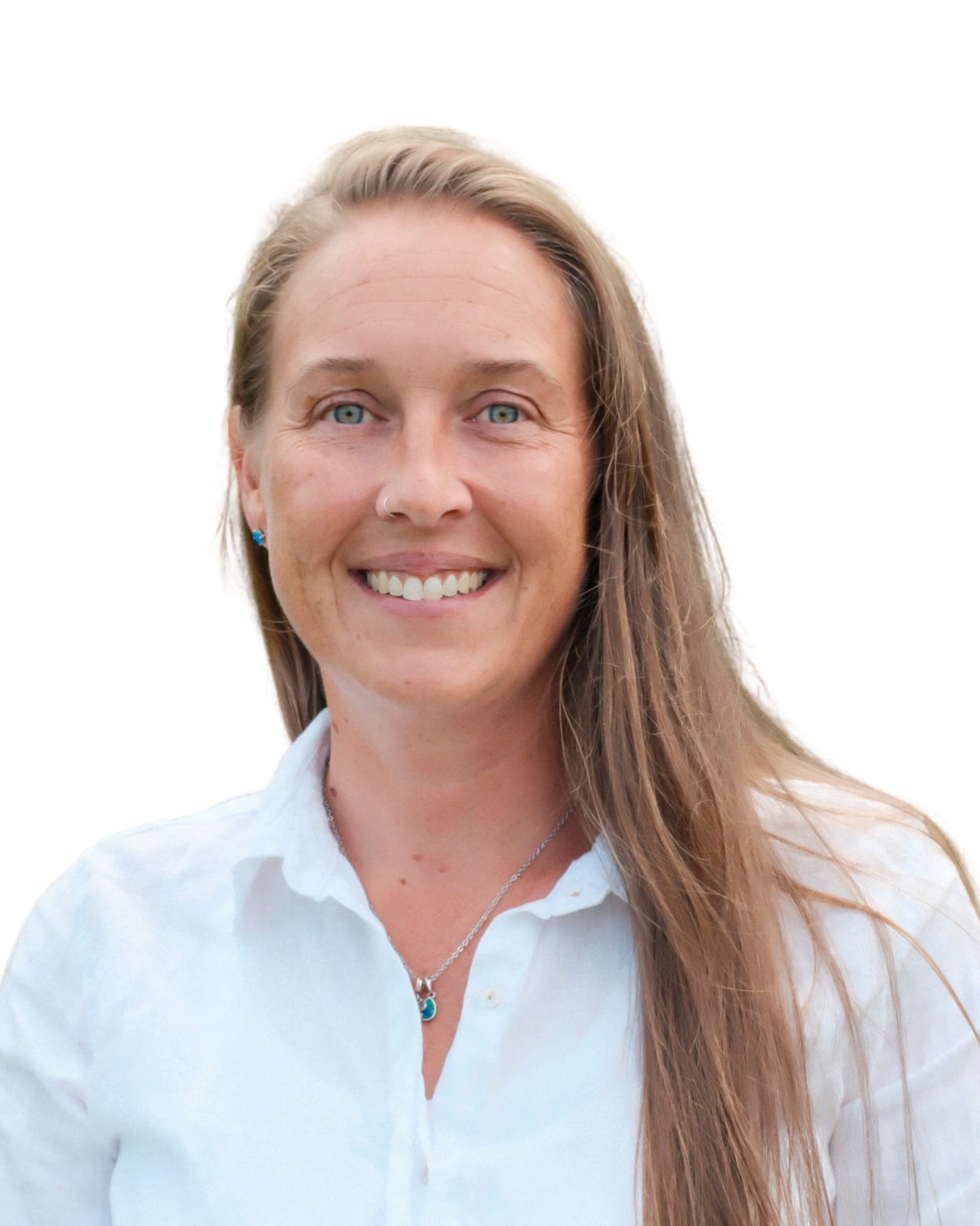 Smiling woman, Psychologist with long blonde hair, blue eyes, wearing a white shirt, a necklace, and earrings.