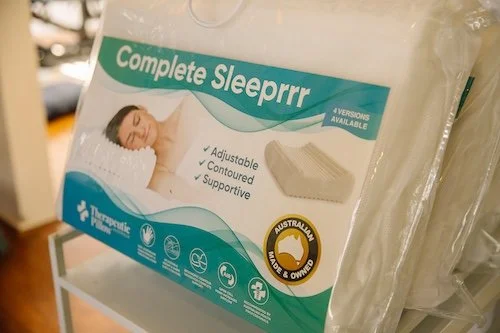 Packaging of a Complete Sleepprr mattress with features listed, showing a woman sleeping and an illustration of the mattress, with an Australian owner label.
