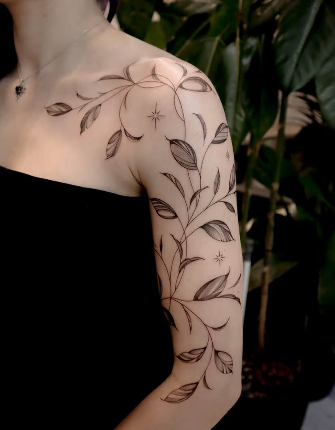 Ms. T is a tattoo artist celebrated for her elegant fine line work and meticulous attention to detail. With a steady hand and a deep love for design, she transforms delicate ideas into timeless pieces of body art. Her specialty lies in floral tattoos