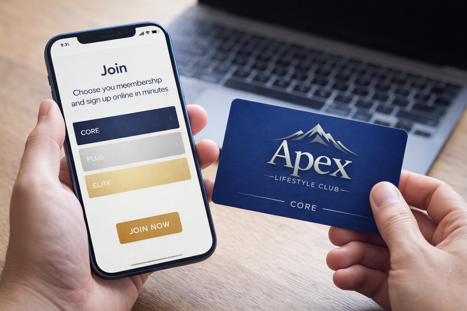 Person holding a smartphone with a membership sign-up screen and a membership card in front of a laptop.