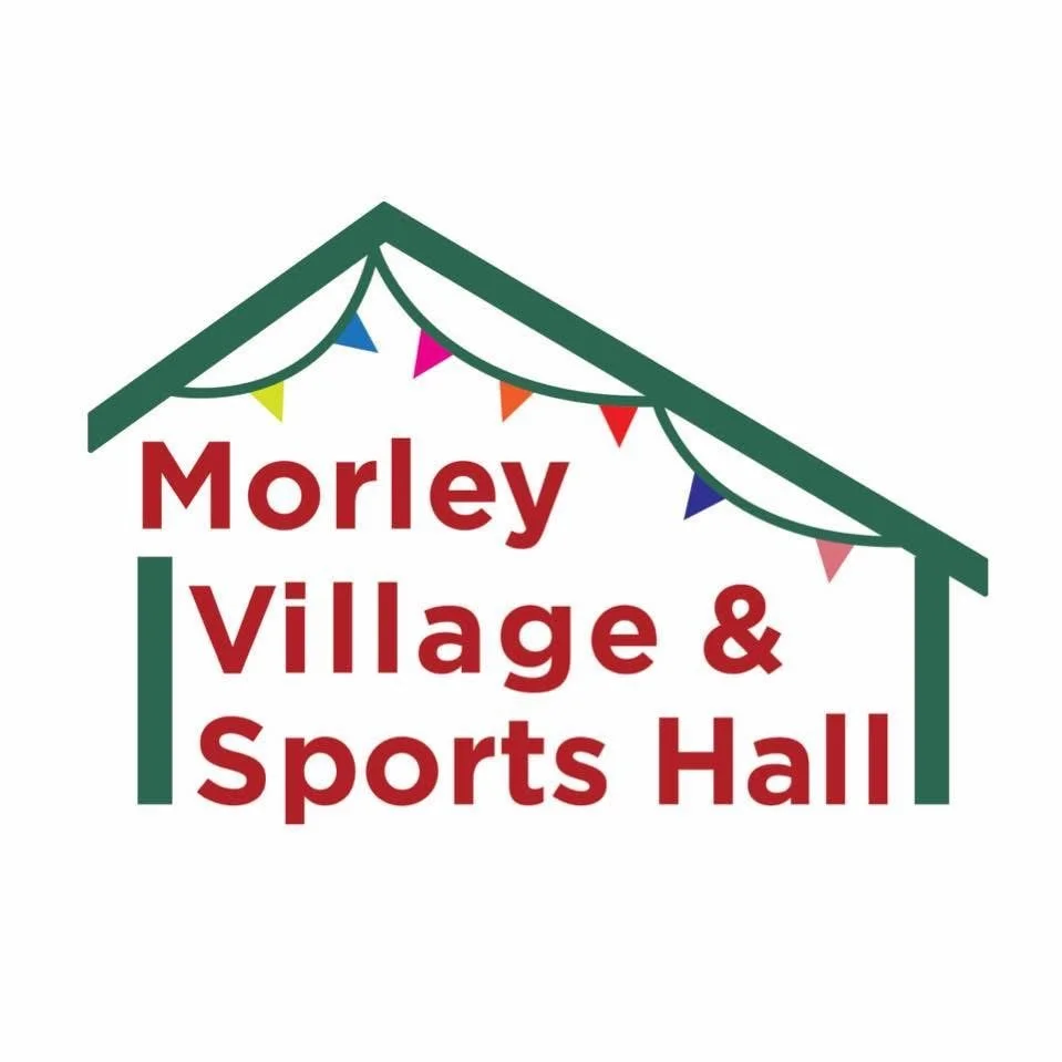 Logo for Morley Village & Sports Hall featuring a stylized house with a green outline and roof, decorated with colorful triangular flags, with the text 'Morley Village & Sports Hall' in red.