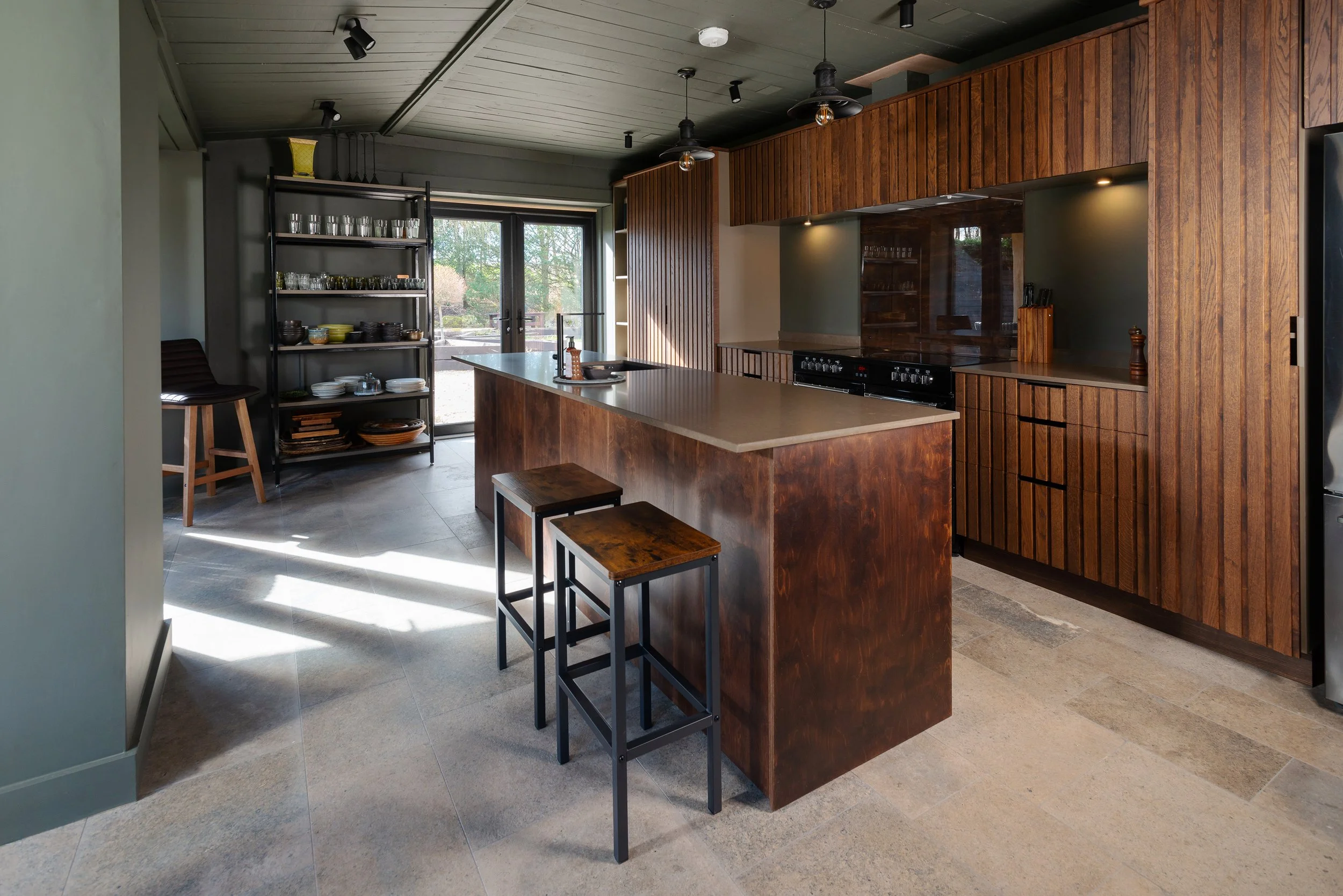 These doors are made of slender strips of oak, the island of Scandinavian plywood with a walnut stain.