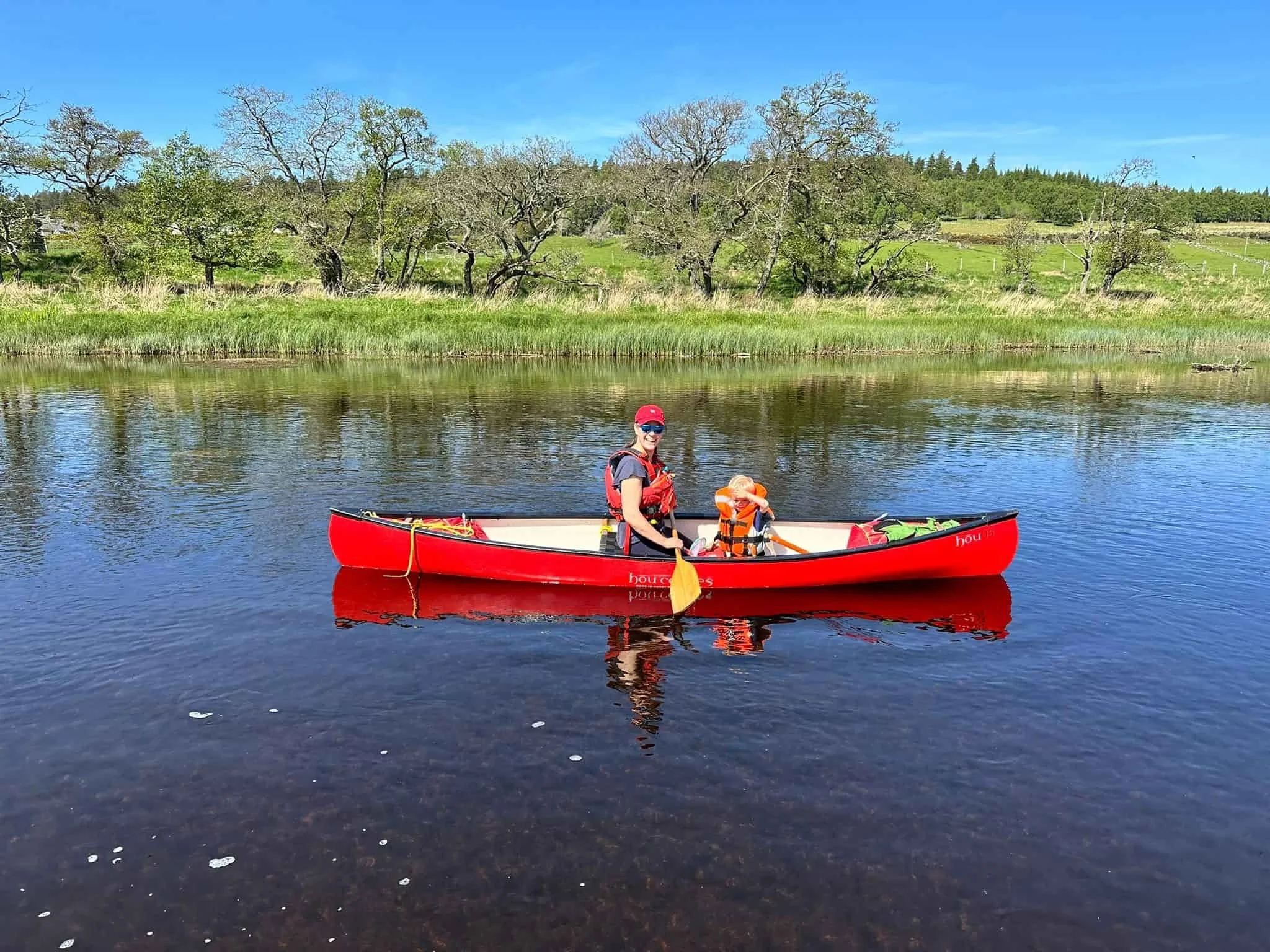 mother and child canoeing river spey