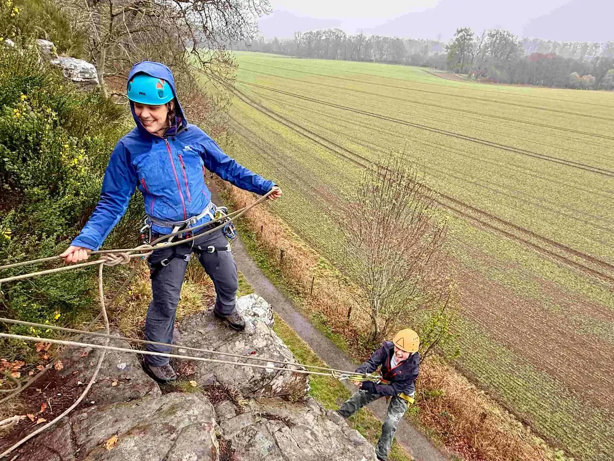 Kids climbing and abseiling