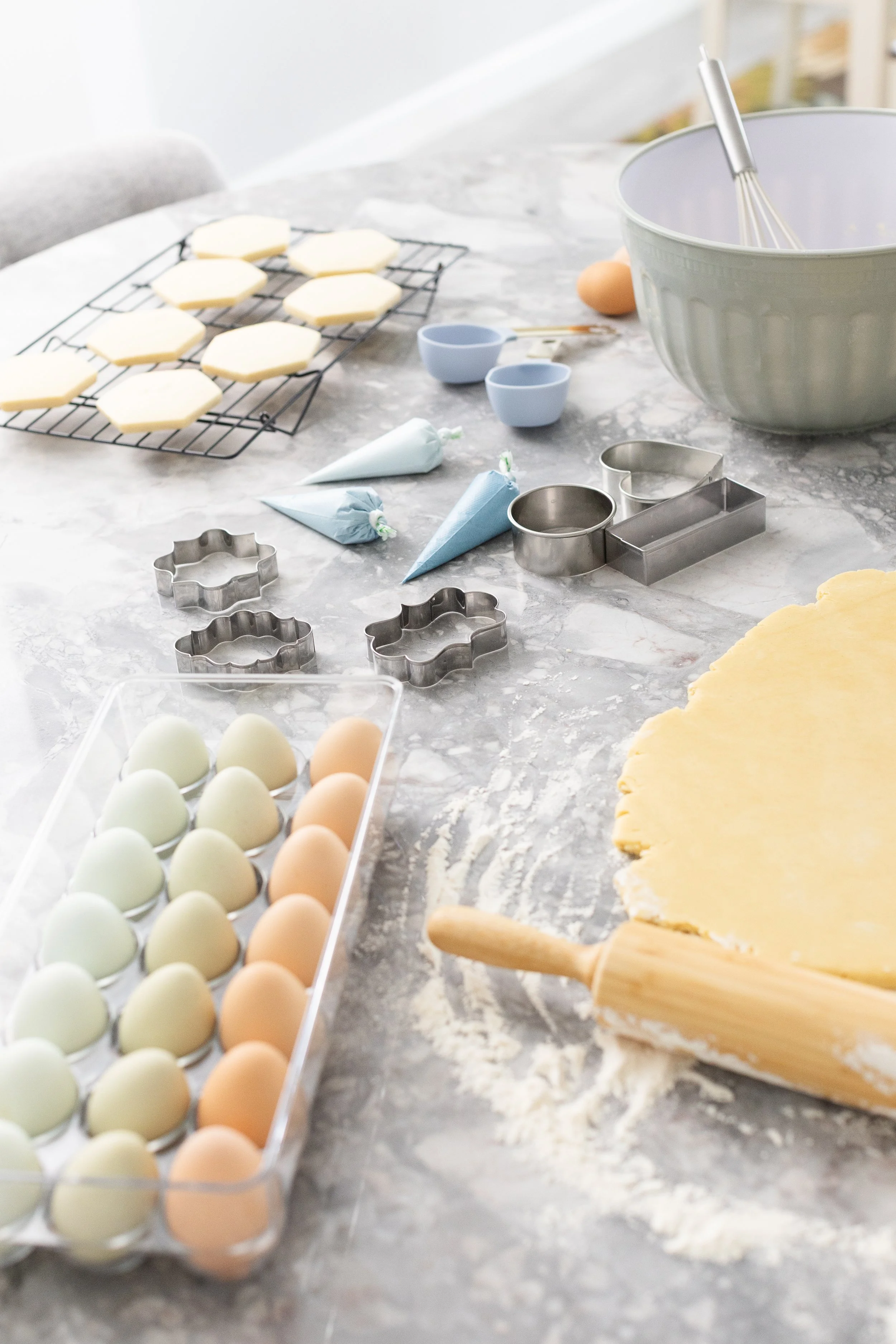 A gray and white countertop with baking ingredients on it.