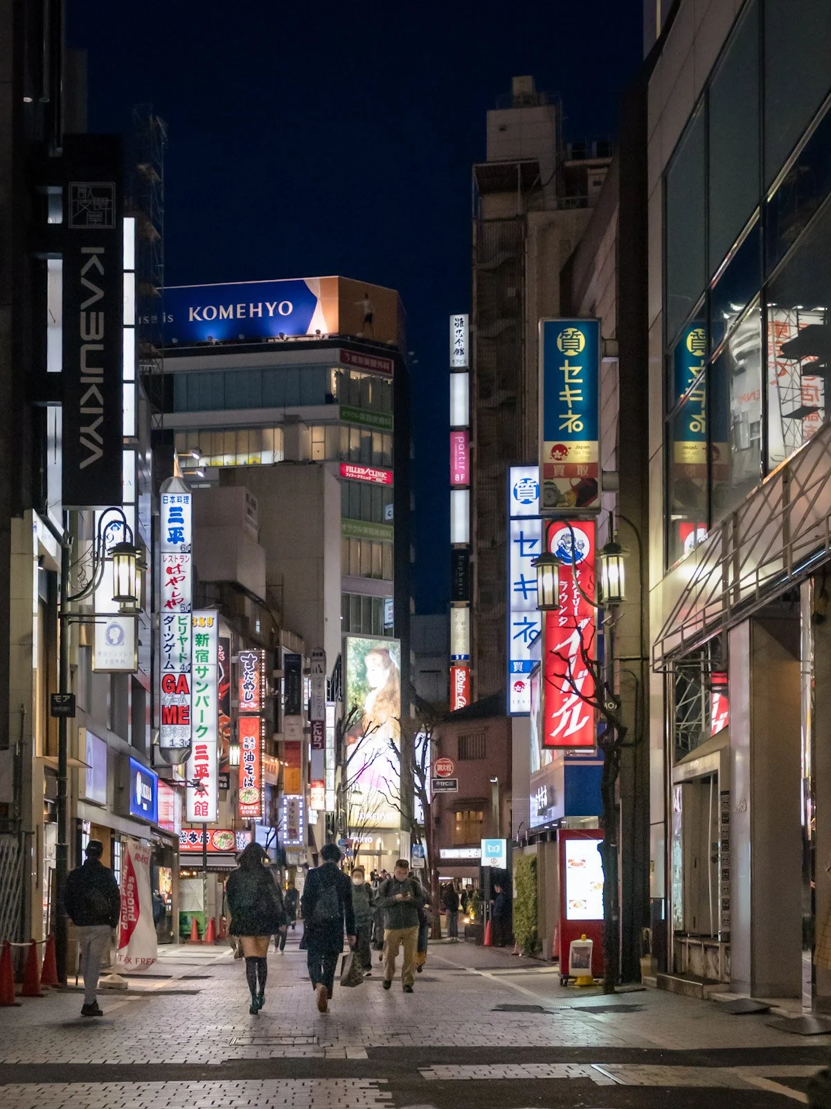 Tokyo street in Shinjuku at night by Tim Tate.jpg