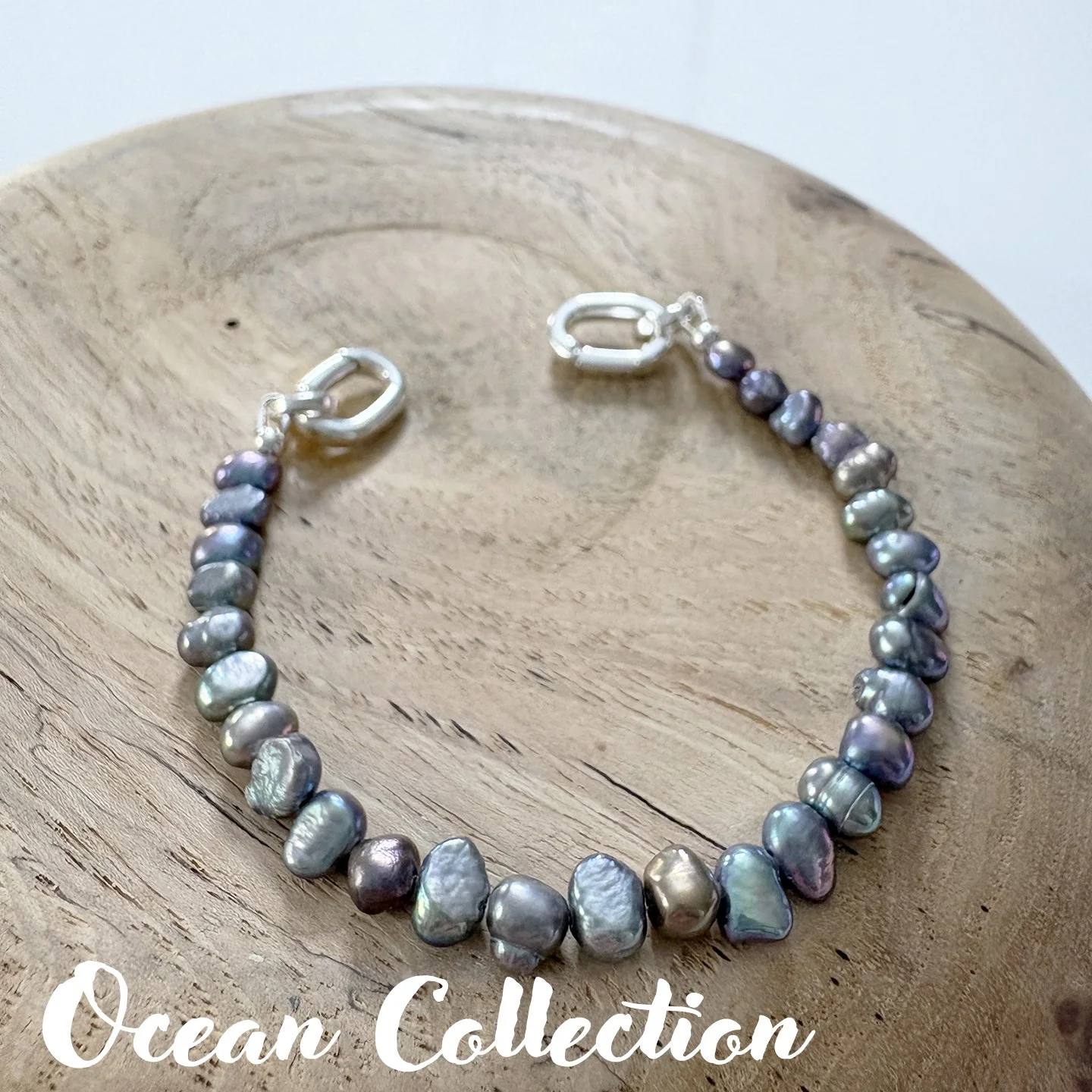 OCEAN 98 Pearl freshwater peacock 8in txt.jpg