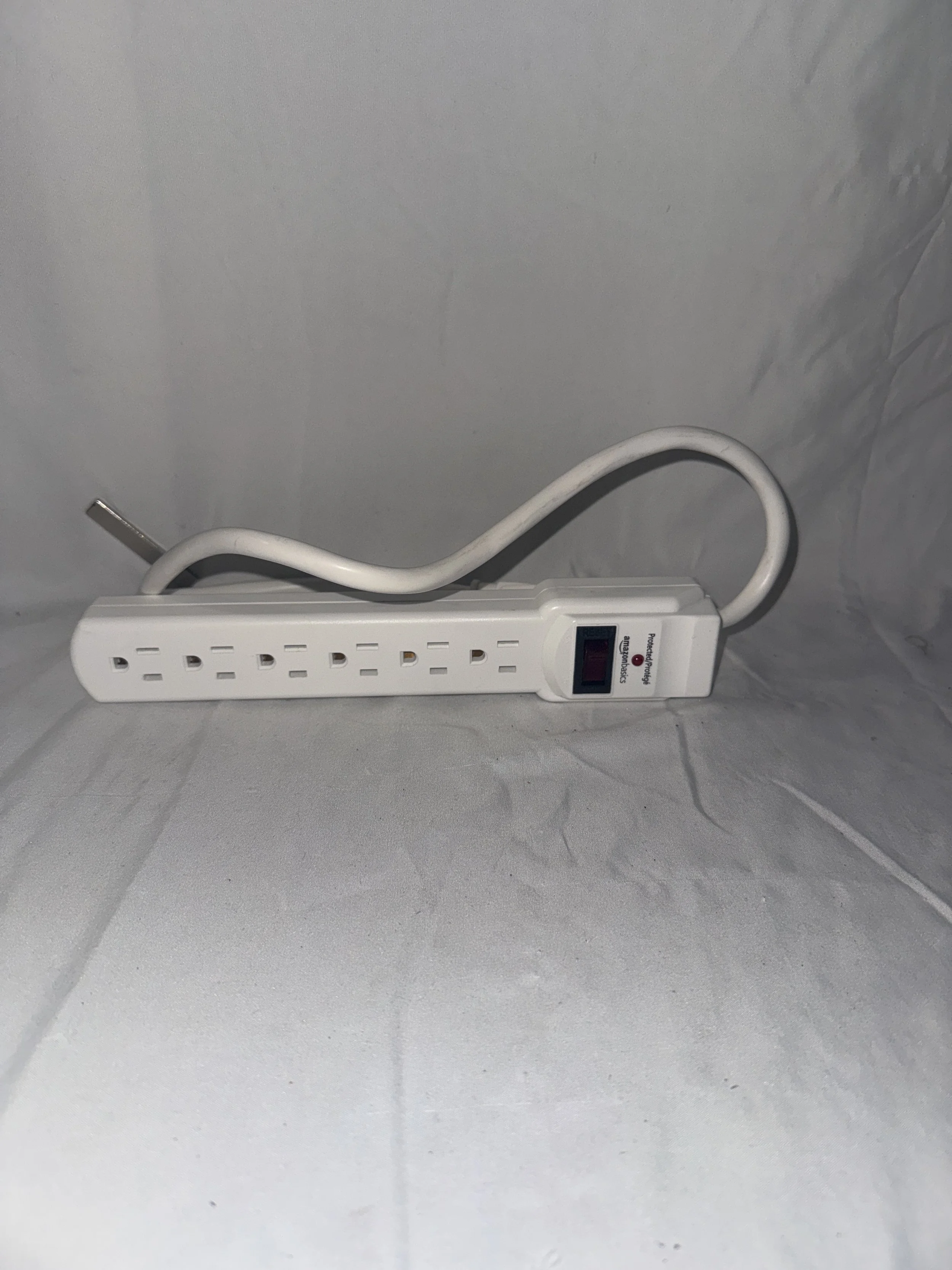 White Amazon Basics Surge Protector