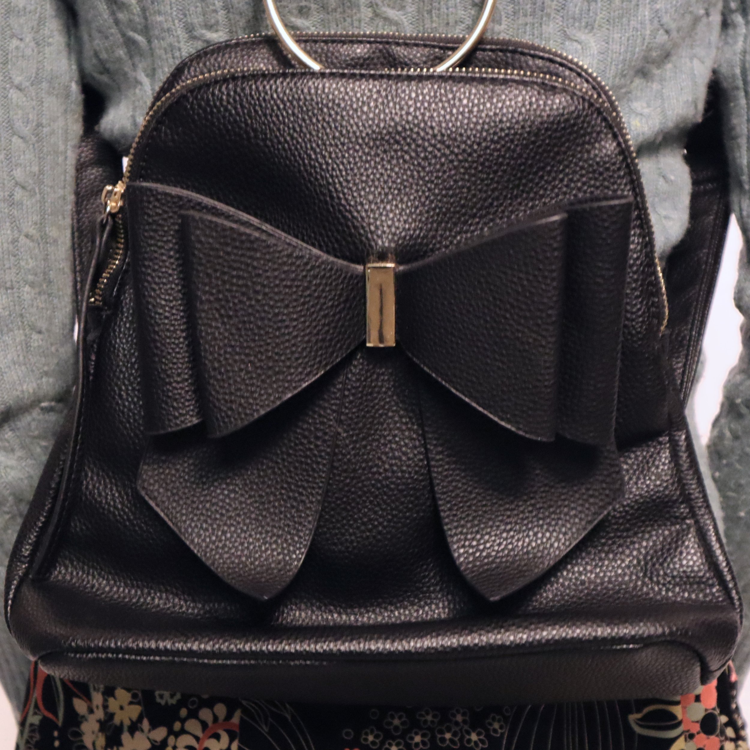 Black backpack with bow.jpeg