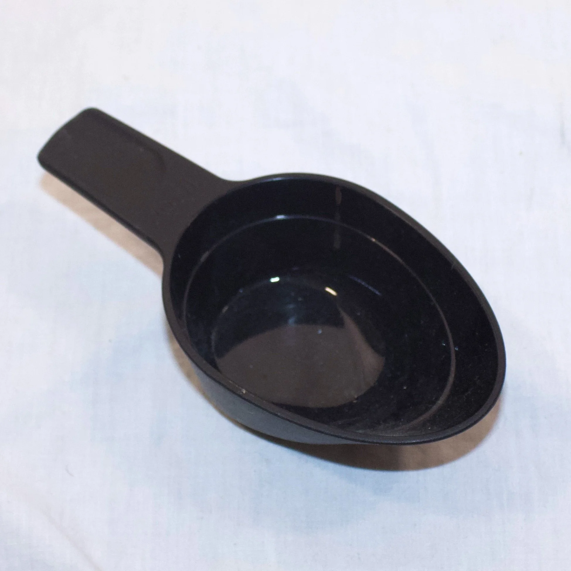 black measuring cup.jpeg