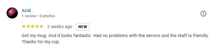 A screenshot of a customer review for a mug titled "Acid." The review has five stars and mentions the customer's satisfaction with the mug's appearance and service.