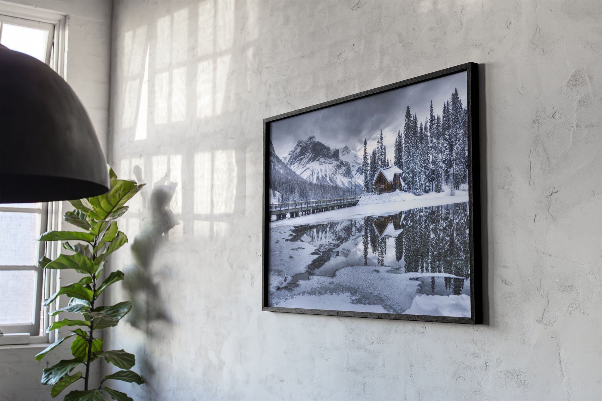 Emerald Lake Lodge Winter framed print on marble wall with sun and reflections.jpg