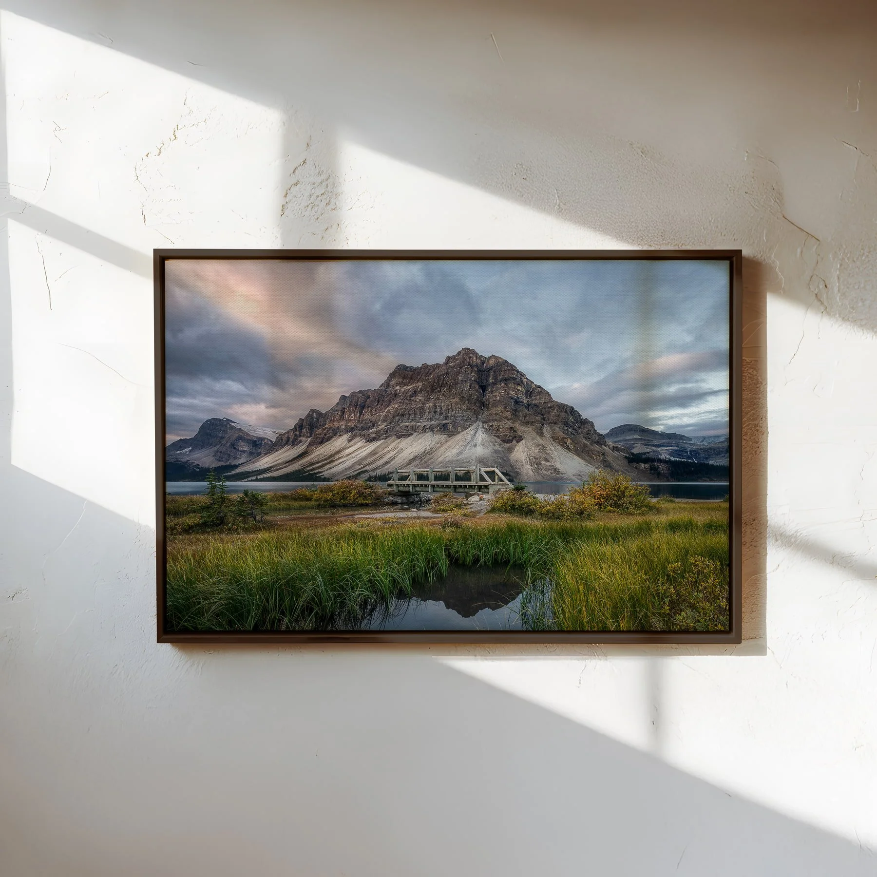 Light over Bow Lake fine art canvas print with slim espresso float frame on textured white wall..jpg