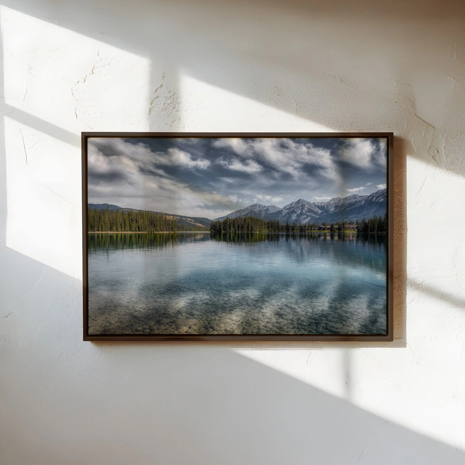 Lac Beauvert fine art canvas print with slim espresso float frame on textured wall with light and shadows.jpg