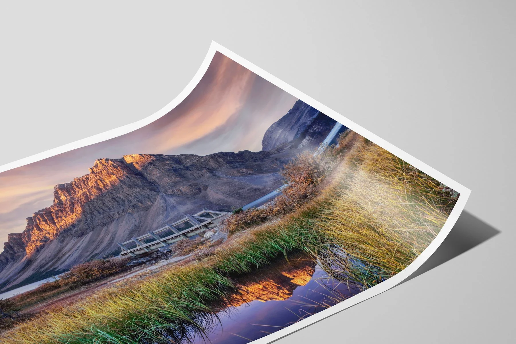Close-up of a Bow Lake at Dawn limited-edition fine-art matte photo print with a white border, shown as an unframed, curled print.