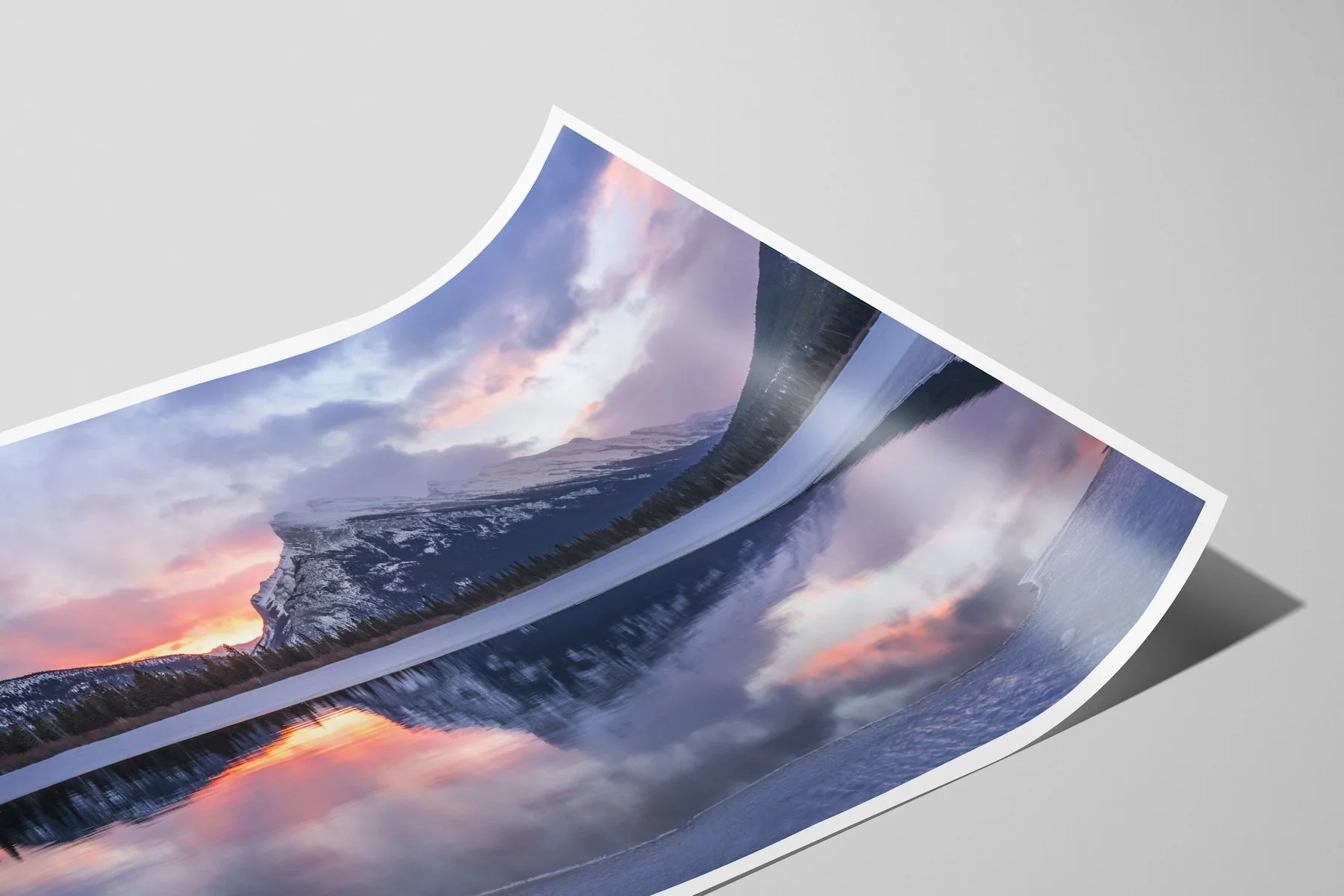 Close up of Mount Rundle Reflections limited-edition fine-art matte photo print with a white border, shown as an unframed, curled print.