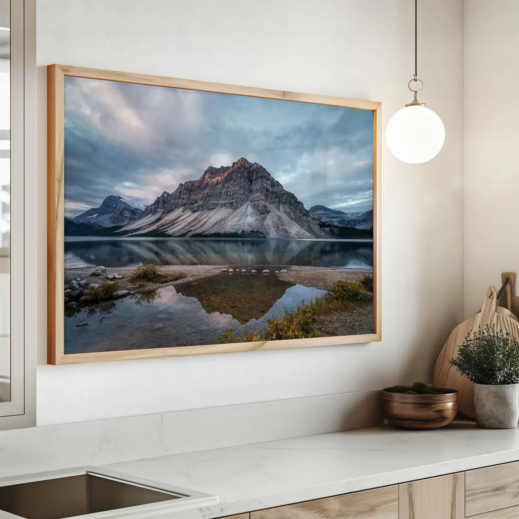 Bow Lake print framed on wall above counter