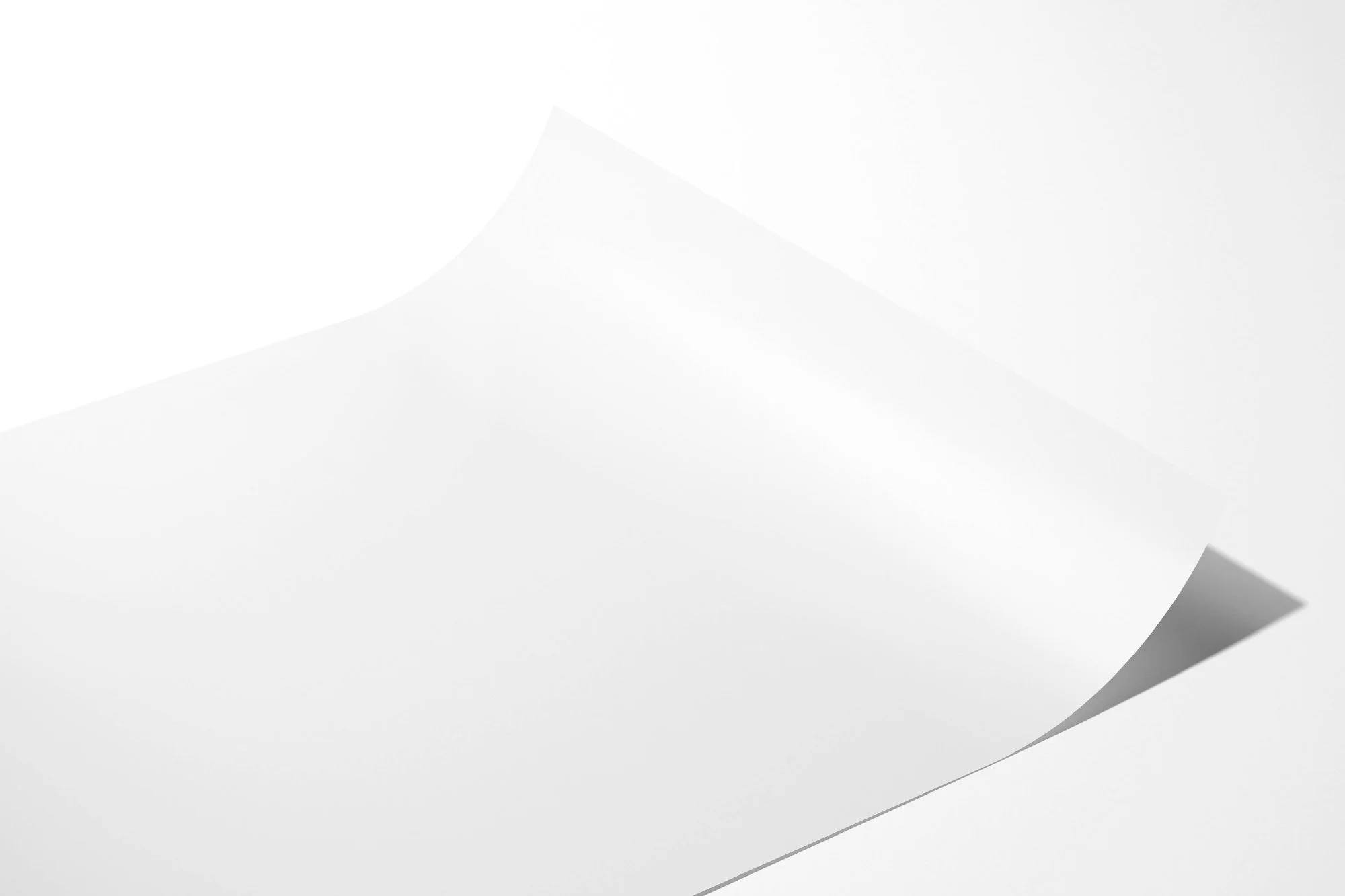 Unframed fine art photography paper print with a subtle curl showing paper thickness and texture