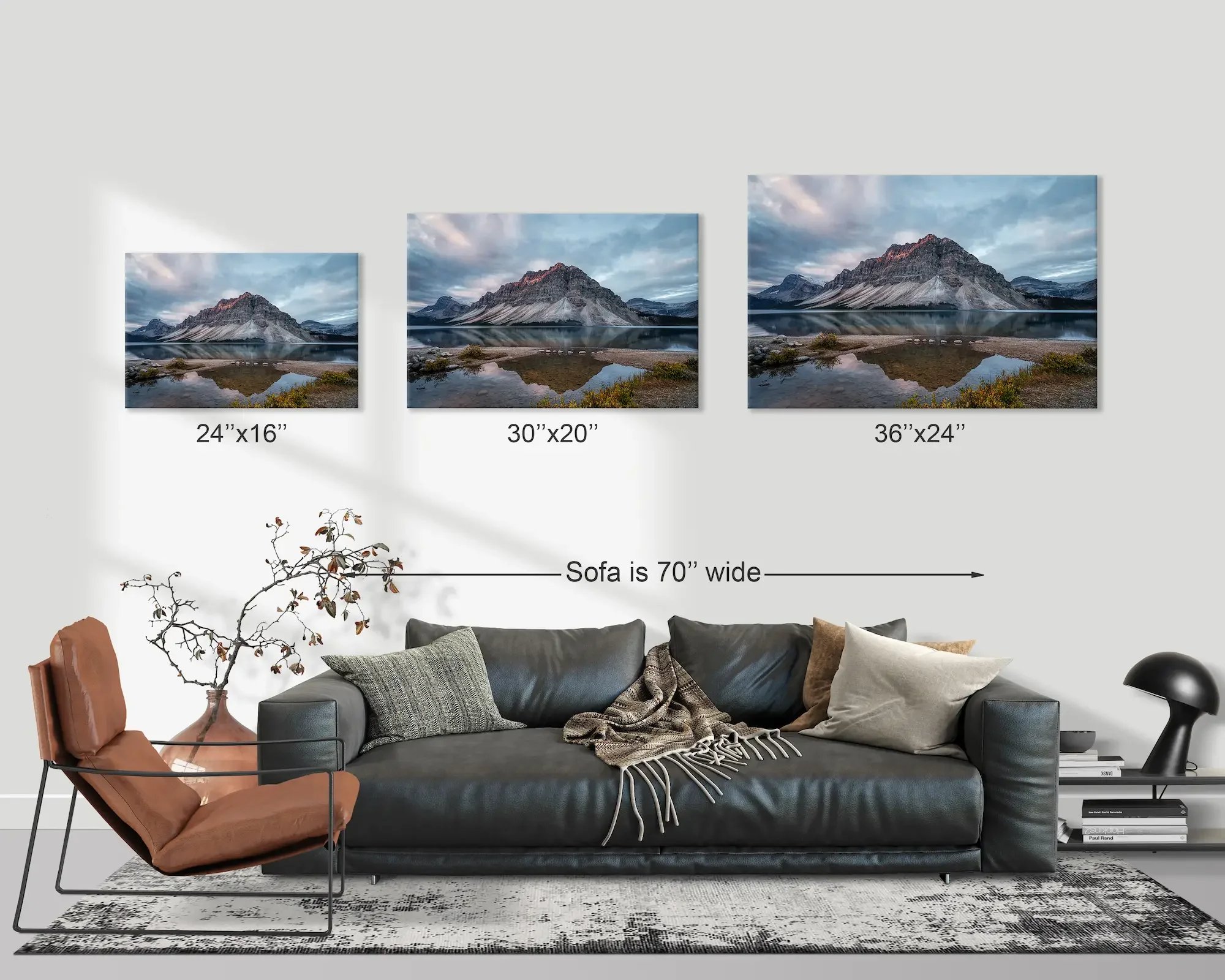 Different print sizes displayed above a couch