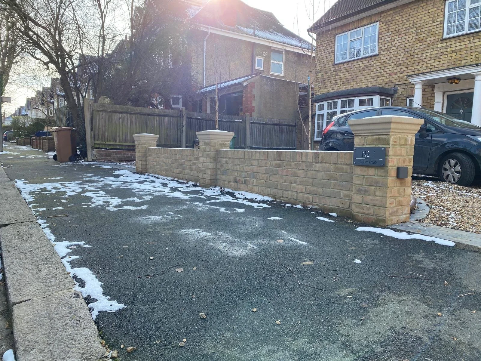 Brick Wall with Sandstone Copings