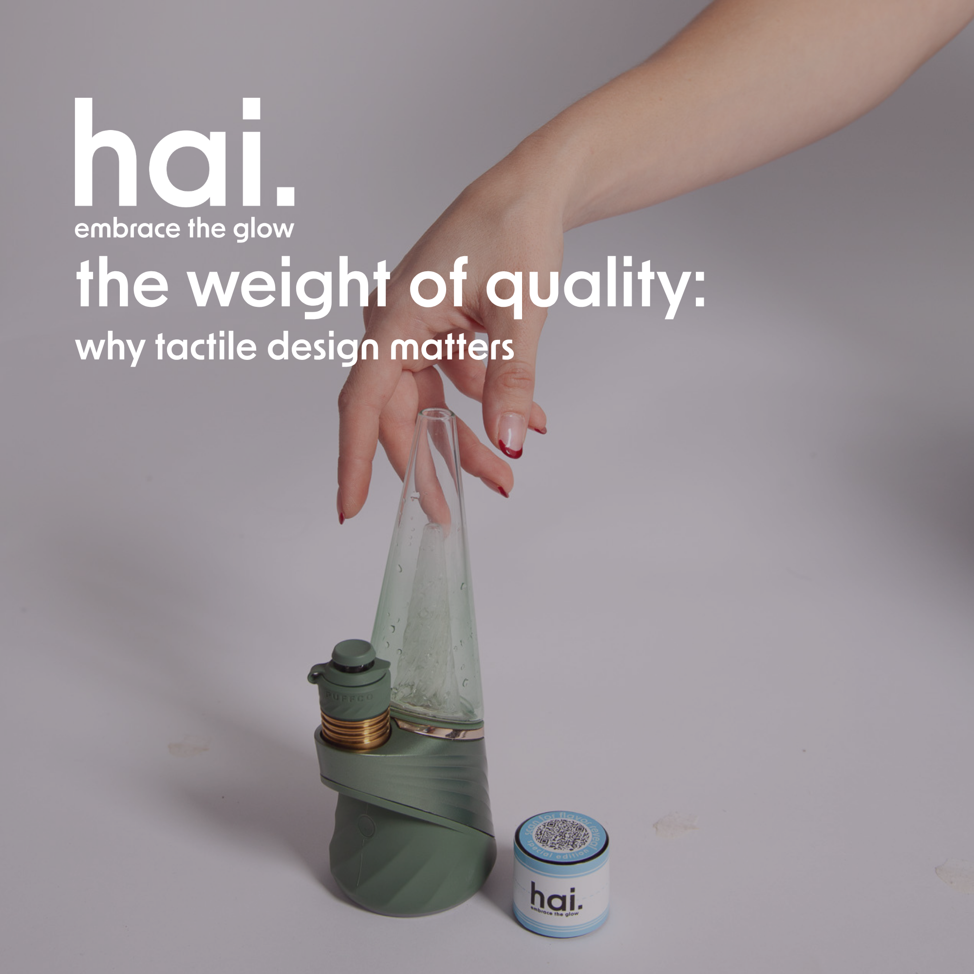 a hand reaching for a puffco and a hai. rosin jar