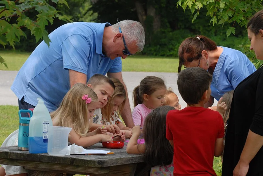 Wes Andrew lends a hand at a Middleburgh Library summer reading event.