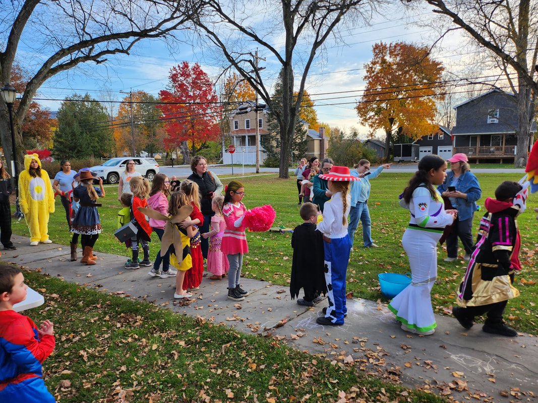 Kids with their families and friends for halloween in Upstate New York small town