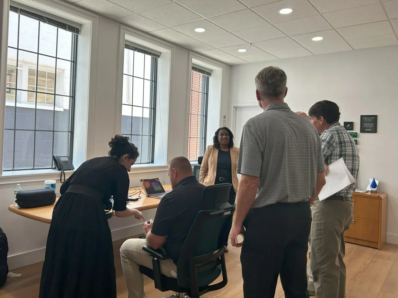 People talking and sharing at a coworking office located in Schoharie County